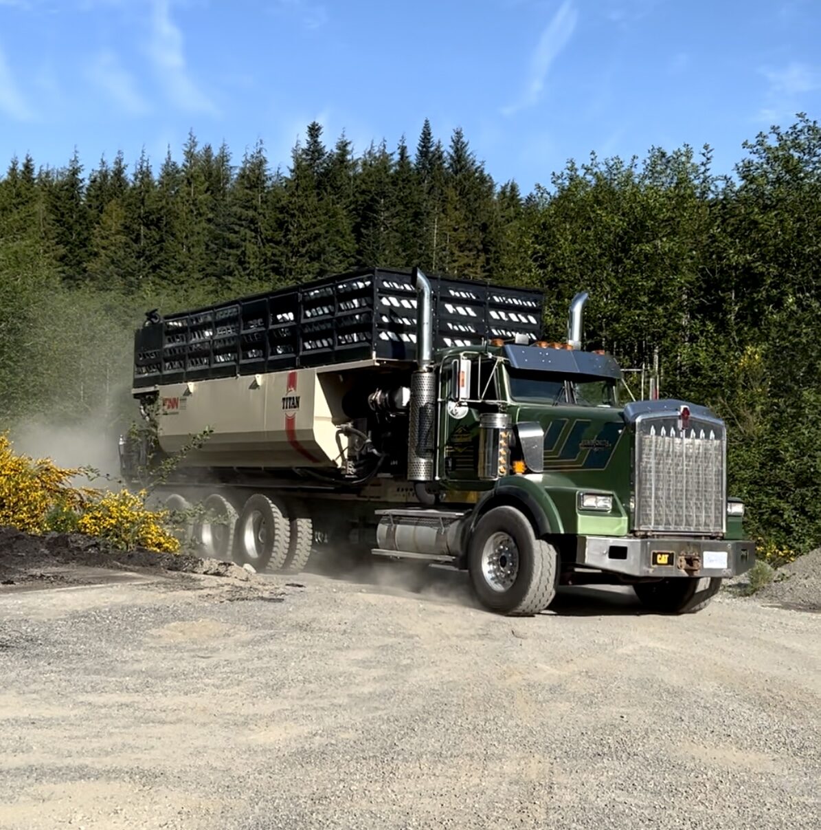 TnT hydroseeding tank truck arriving on a gravel site on Vancouver Island